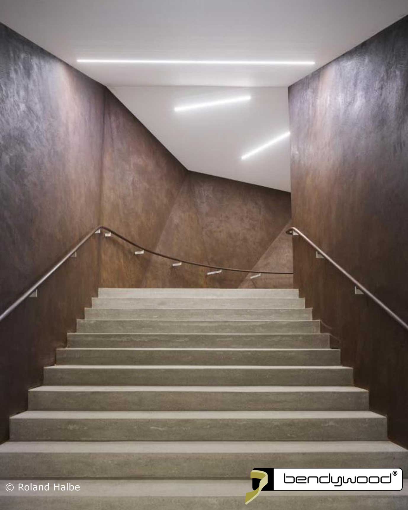 Stairs new concert hall Andermatt, Switzerland. Curved inner and outer handrails in Bendywood® oak.